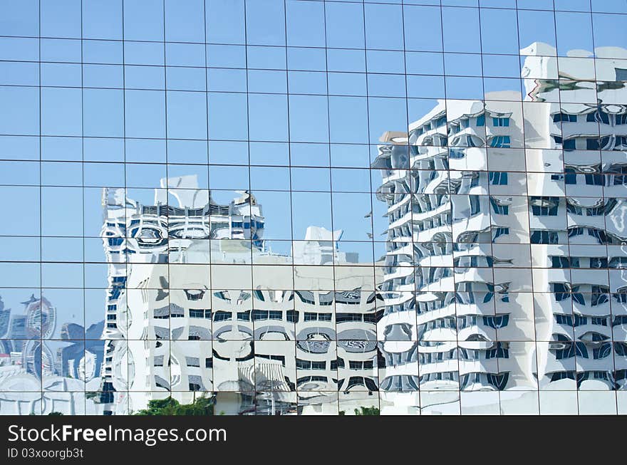 Reflection in a mirror image of the building.