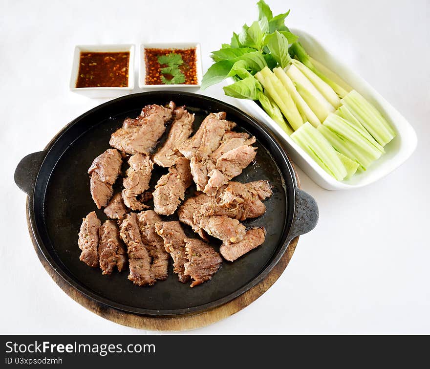 Roasted beef fillet on a hot plate ,served with vegetable