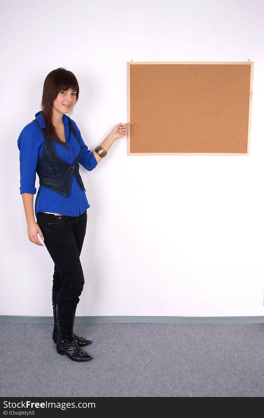 Beautiful woman pointing at the board.