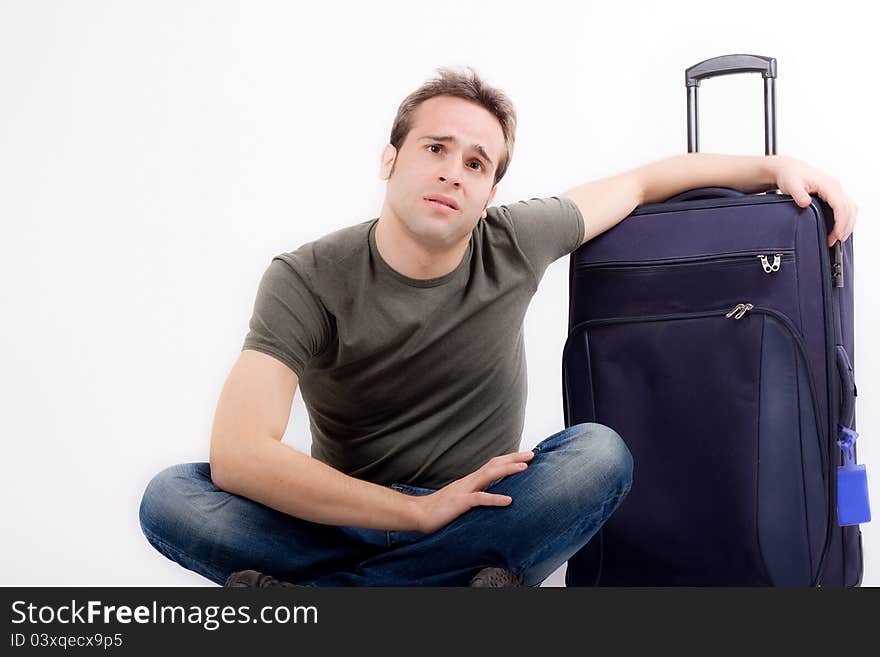 Young man is waiting with a trolley