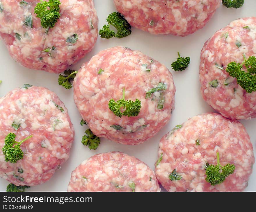 Minced meatballs on a white plate close up