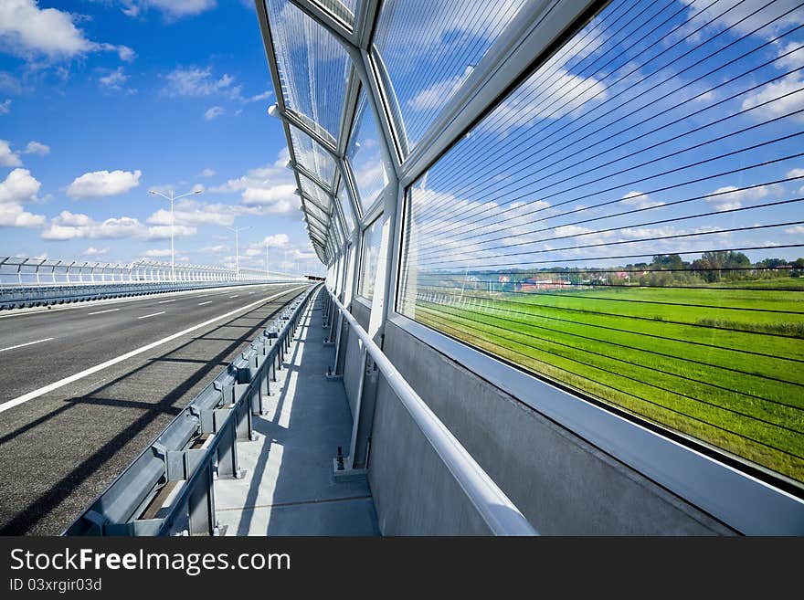 Sound absorption walls on a highway. Sound absorption walls on a highway