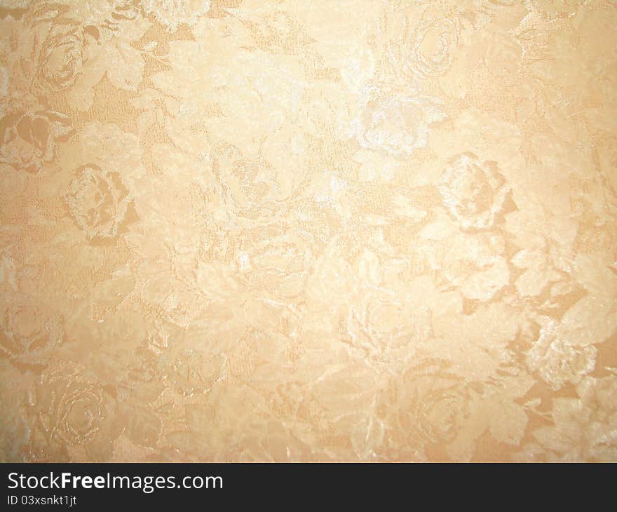 The light brown pattern on the wallpaper. The light brown pattern on the wallpaper