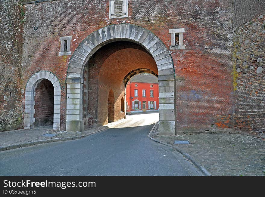 A typically french village scene showing the quiet streets, and historical architecture. A typically french village scene showing the quiet streets, and historical architecture