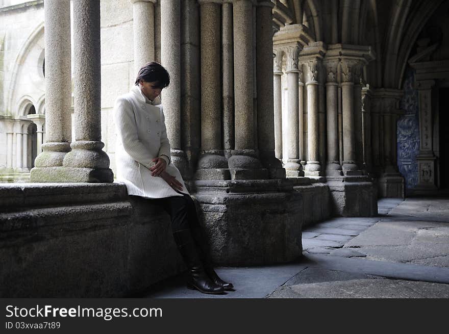 Woman meditating in the cloister