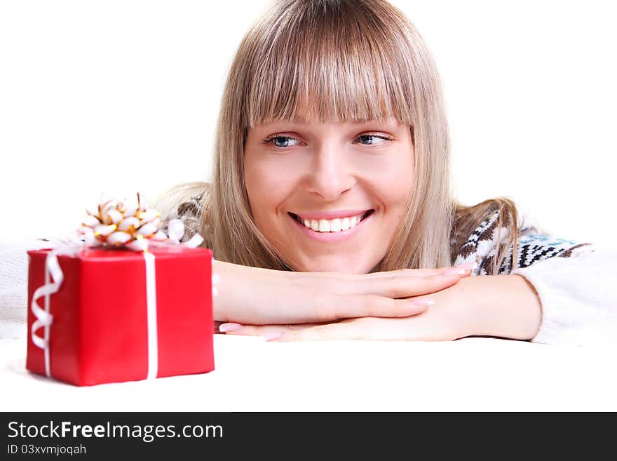 Young lady looking to box of gift. Young lady looking to box of gift