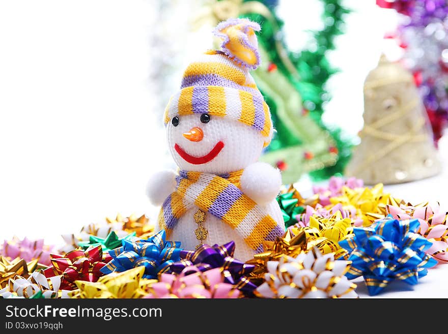 Snowman on the background of Christmas decorations