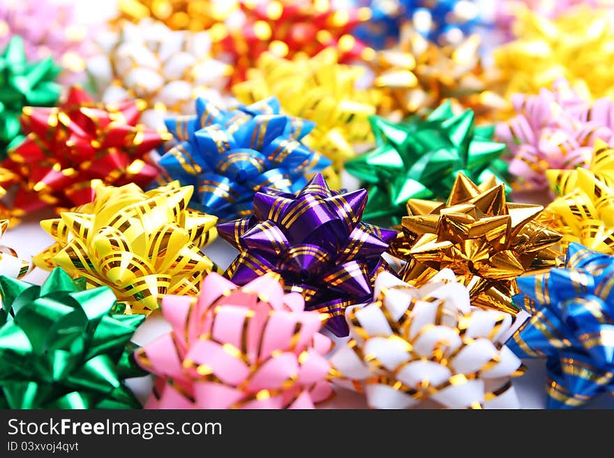 Colorful christmas background of bows. Colorful christmas background of bows