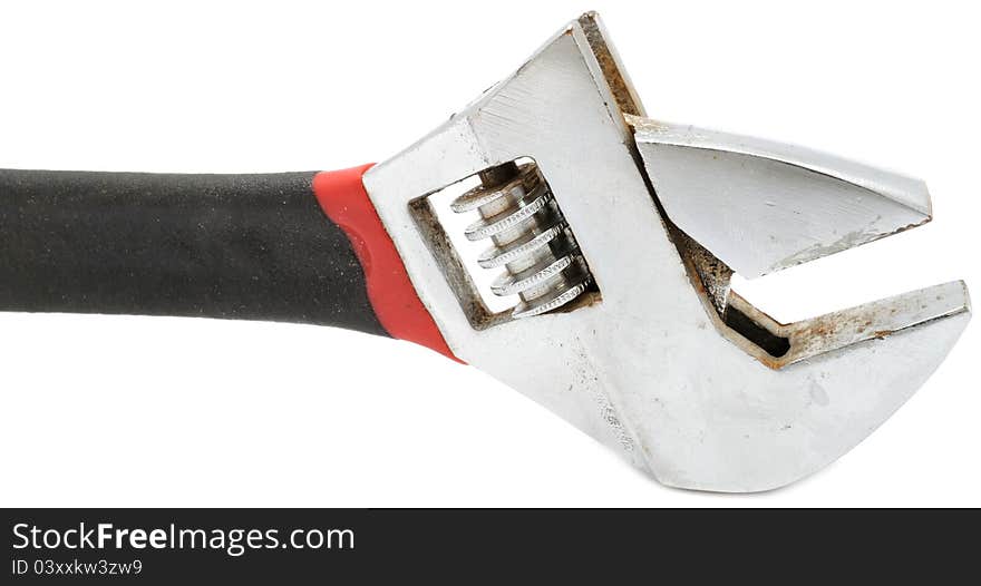 An adjustable wrench (spanner) on a white background