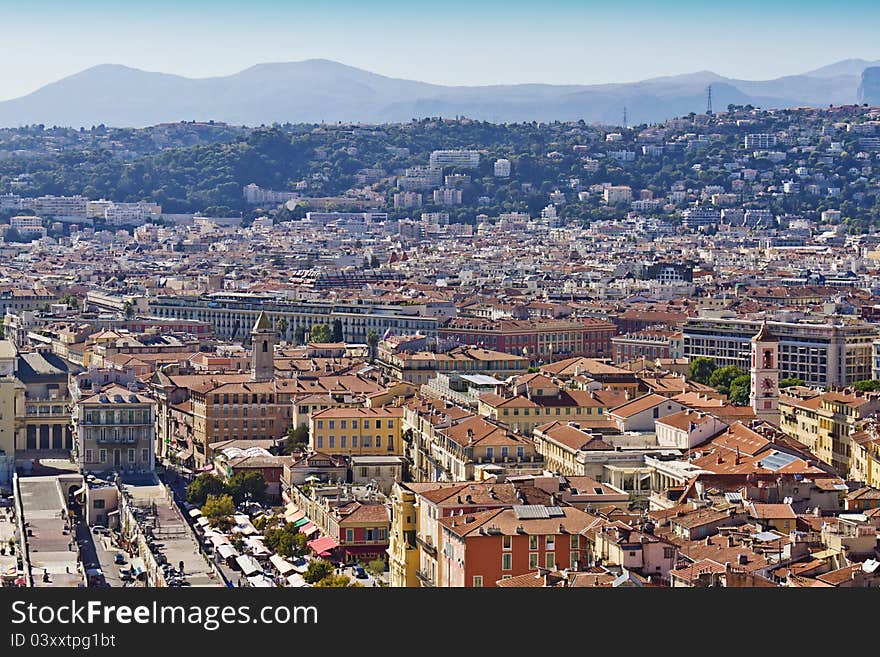 Historical part of Nice - luxury resort of French Riviera. Wonderful panoramic view of Nice with colorful historical houses of the old city, made from the Castle Hill. France, Europe, Cote D'Azur. Historical part of Nice - luxury resort of French Riviera. Wonderful panoramic view of Nice with colorful historical houses of the old city, made from the Castle Hill. France, Europe, Cote D'Azur