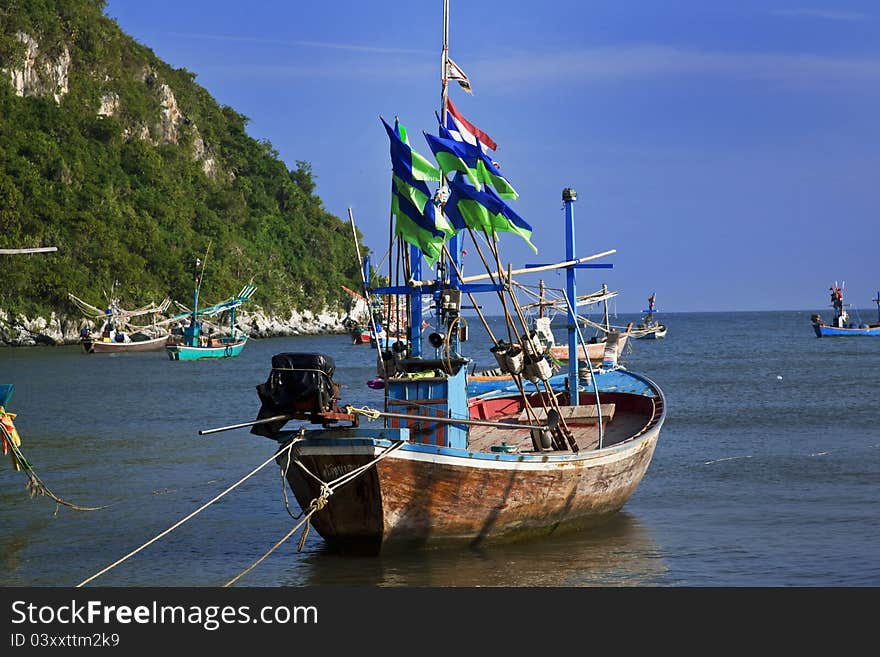 Blue boat in the sand on the beach in Pranburi, Thailand. Blue boat in the sand on the beach in Pranburi, Thailand