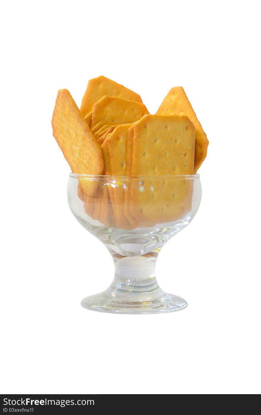 Cookies in a glass dish on white background