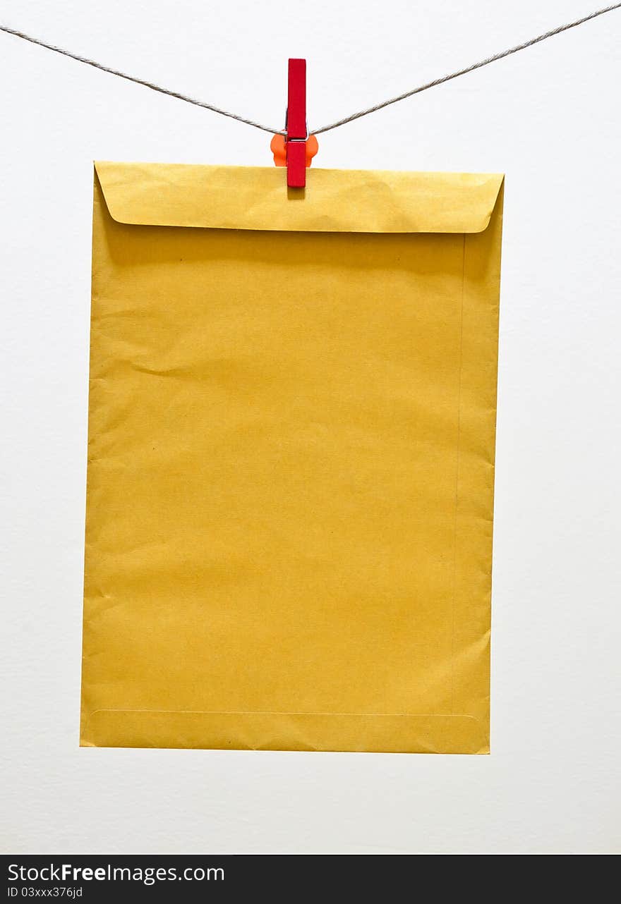 Envelope and green clothespin