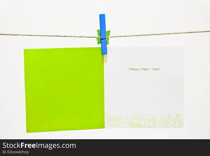 Green clothes-pin holding Greeting card