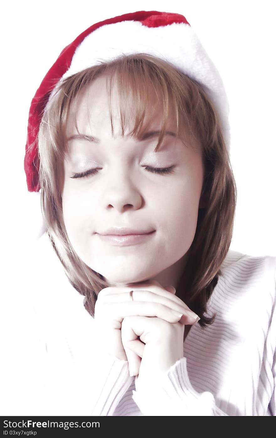 Very high key shot of girl with christmas hat. Very high key shot of girl with christmas hat