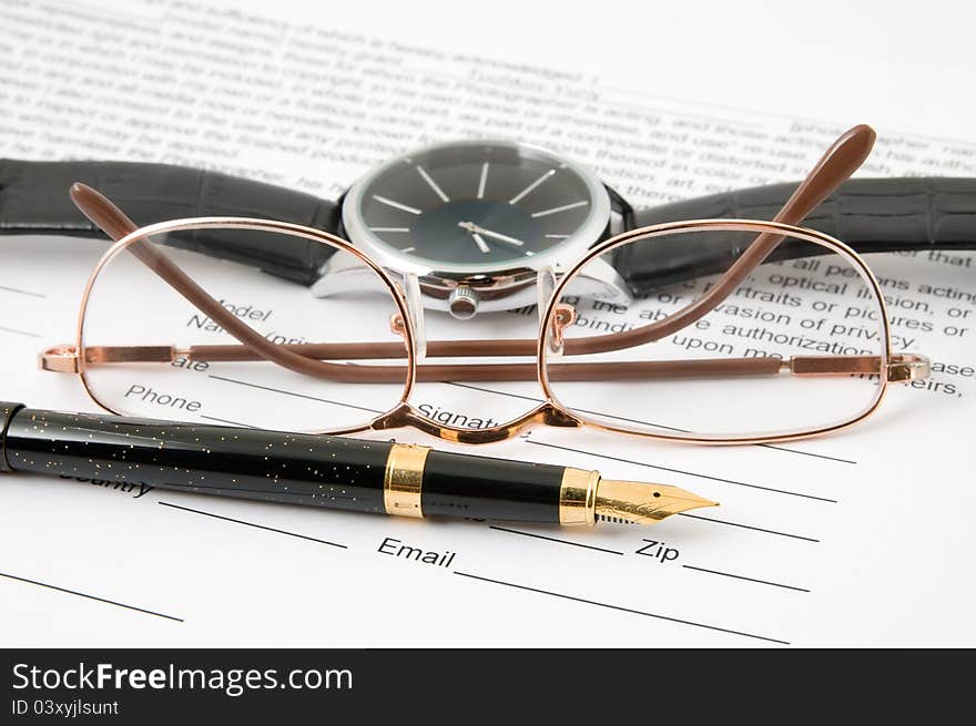 Eyeglasses And Pen And Wristwatch