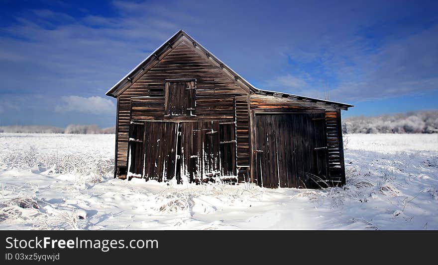 Old barn in the snow after a storm. Old barn in the snow after a storm