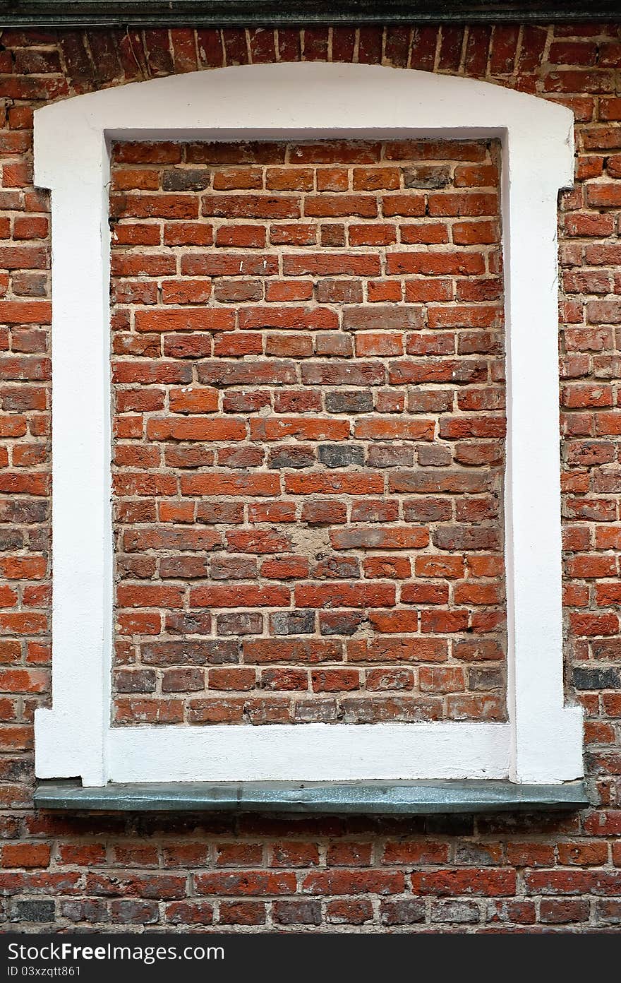 White window frame filled with bricks. White window frame filled with bricks