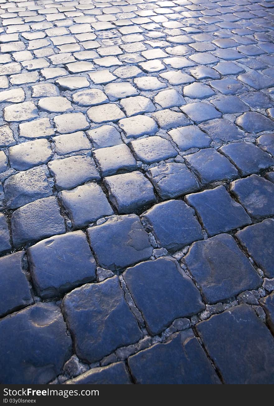 Cobblestone street at dusk, background. Cobblestone street at dusk, background.