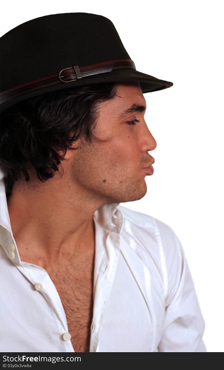 Fashion guy isolated with white shirt and hat looking in a funny expression. Fashion guy isolated with white shirt and hat looking in a funny expression