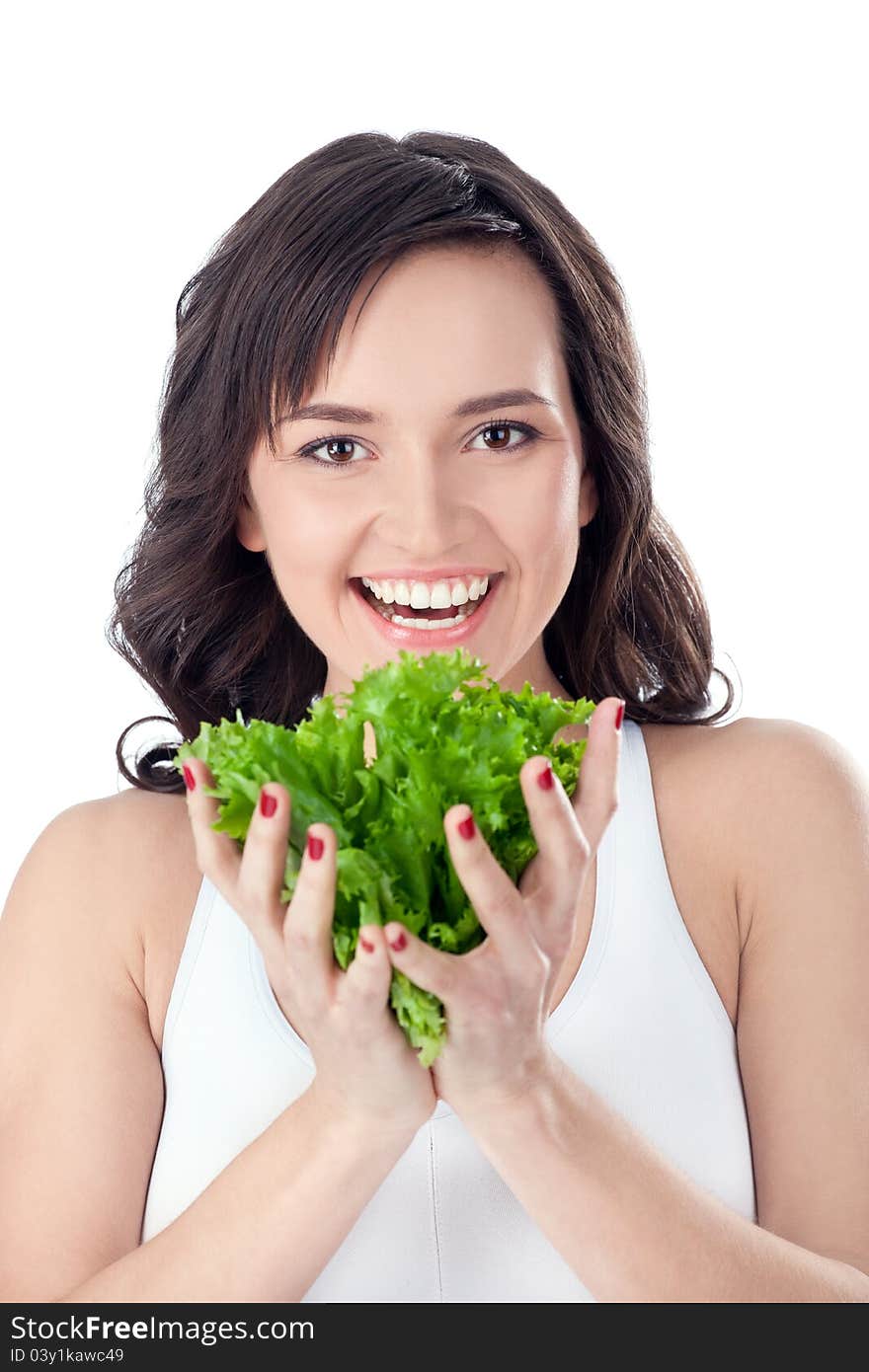 Young girl eating salad sitting on her bed at home. Young girl eating salad sitting on her bed at home