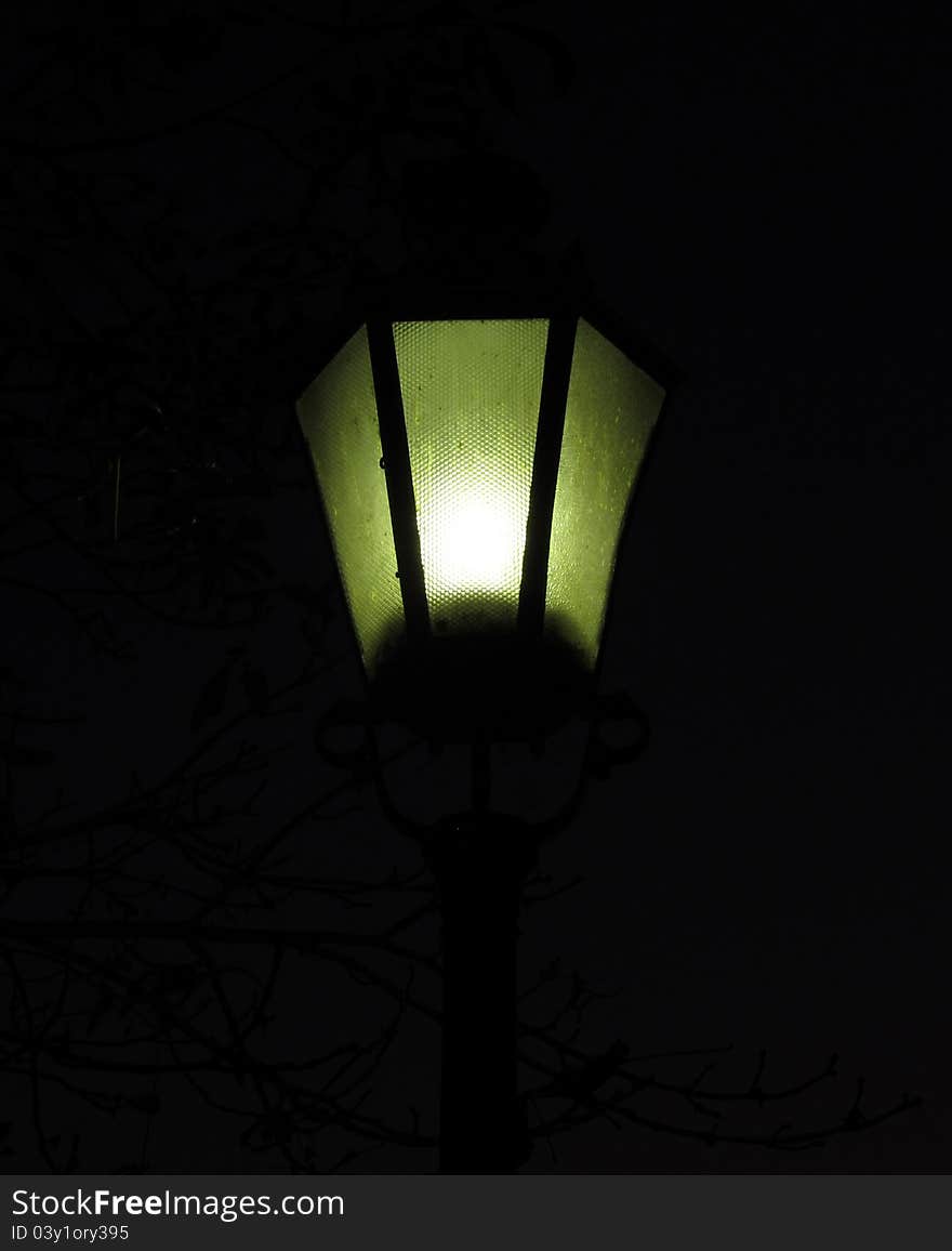 Clearly highlighted a glowing lantern. Symbol of a landmark or loneliness. Clearly highlighted a glowing lantern. Symbol of a landmark or loneliness.