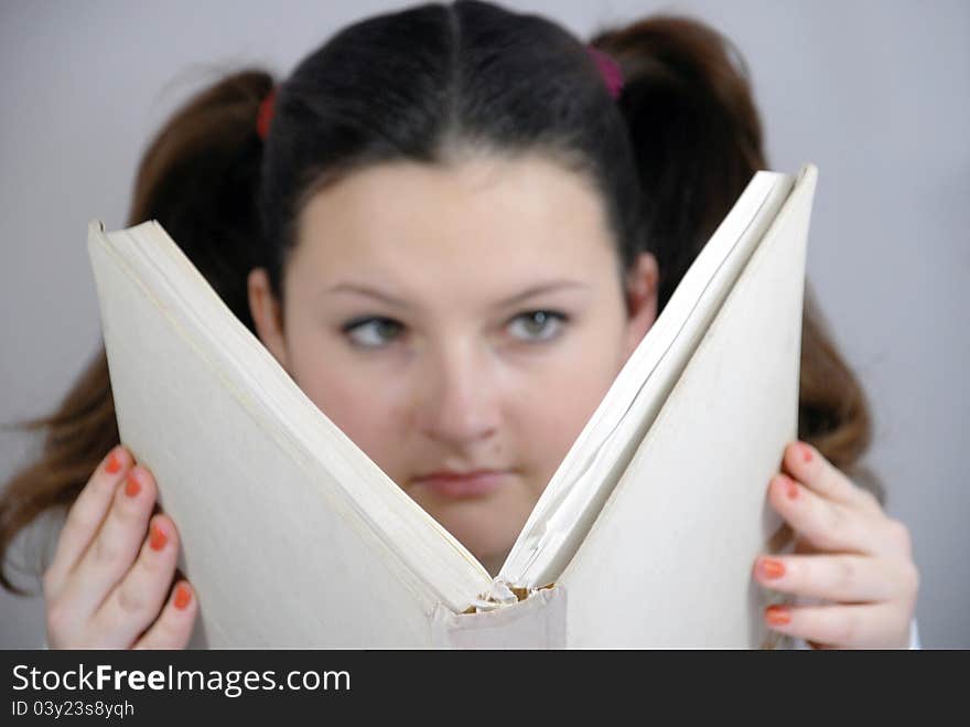 Schoolgirl with a big book