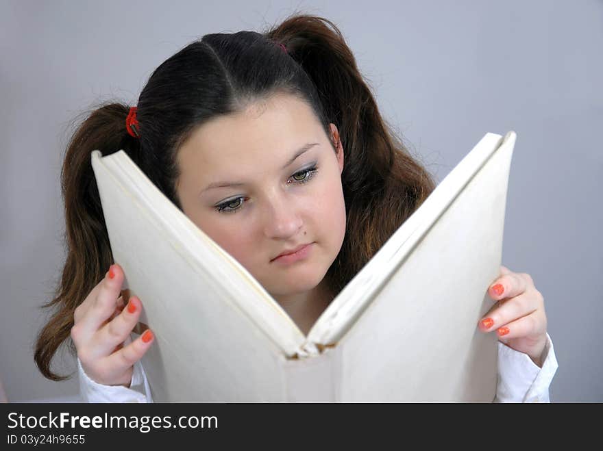 Schoolgirl reading a great book