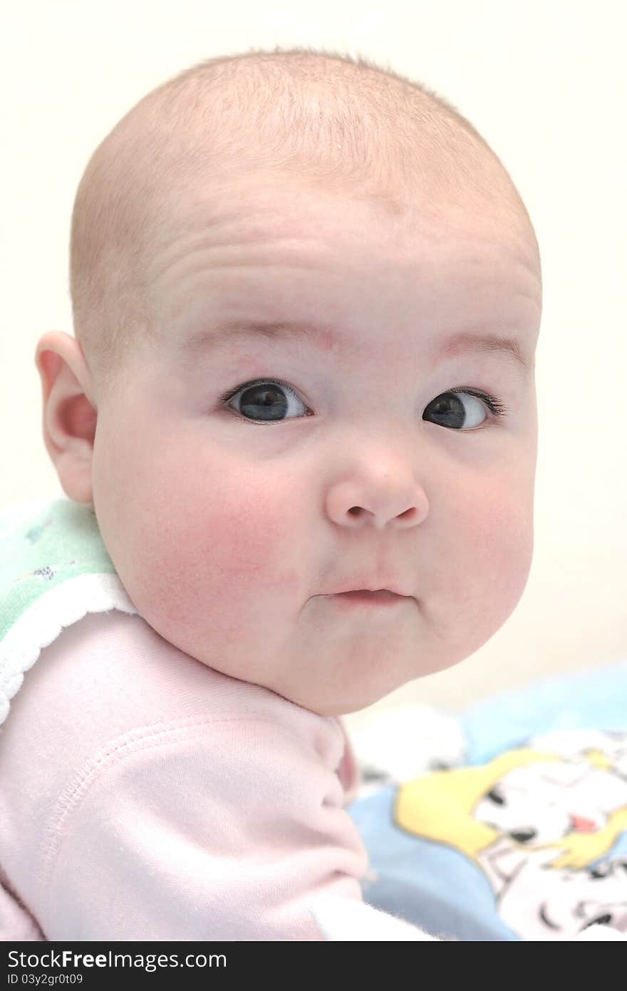 On a photo Child portrait. Big face. On a photo Child portrait. Big face