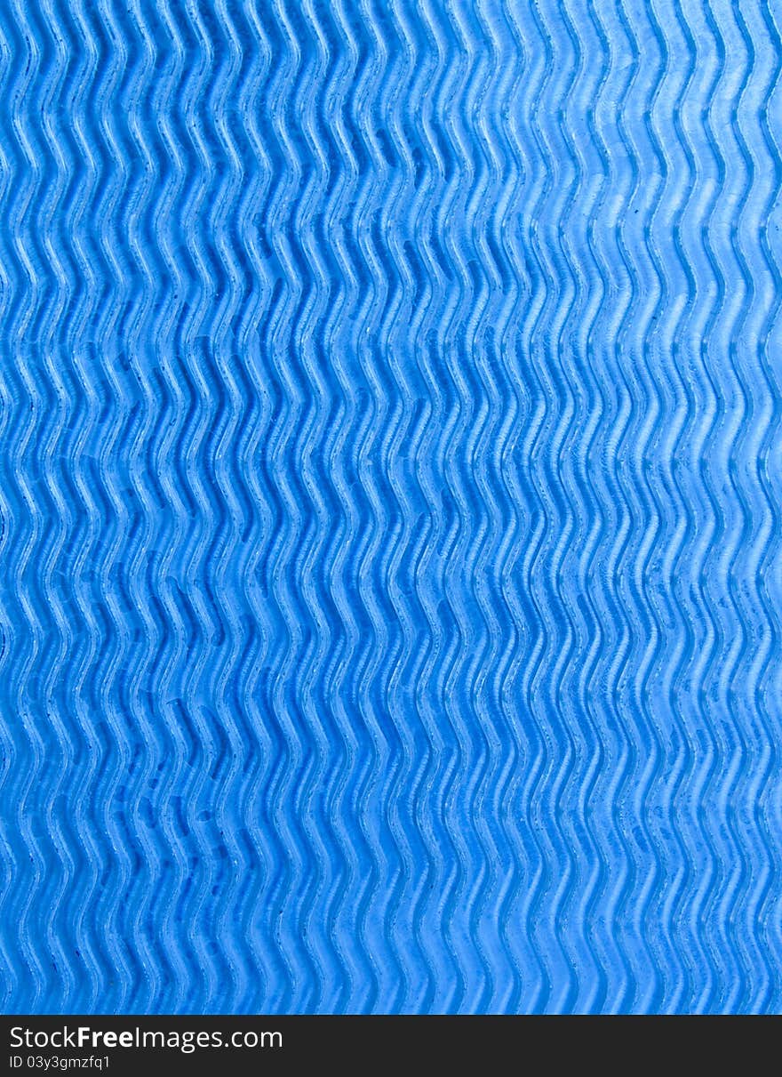 Wave design on blue-silver metal sheet