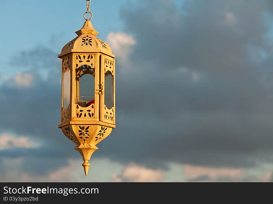 Beautiful old lantern over the blue sky