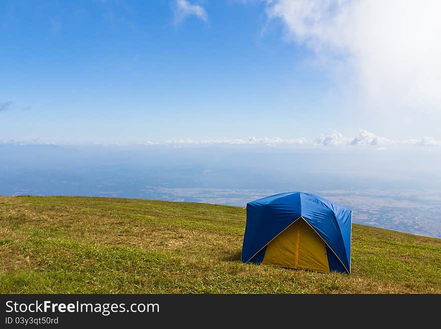 Tent on a grass under  blue sky