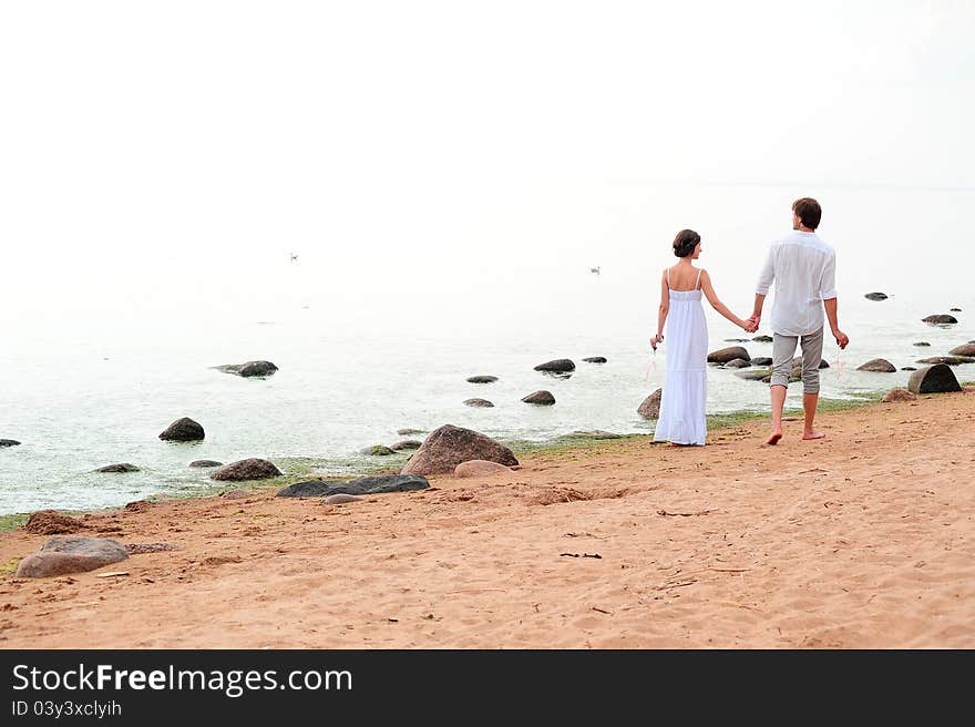 Young romantic couple on the beach