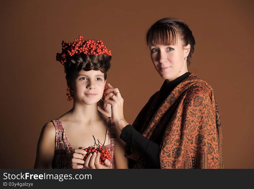 Makeup stylist adjusts the model in the studio