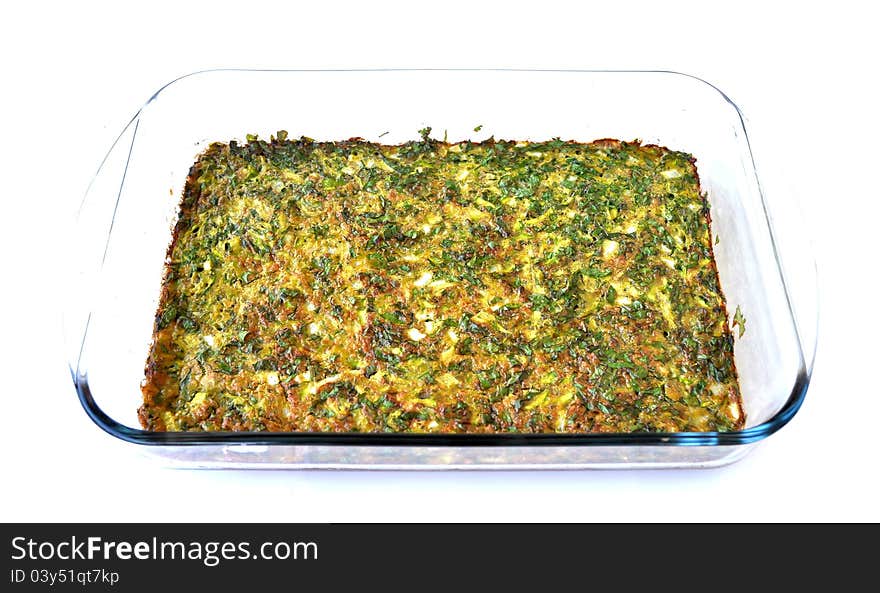 An omelet spread with parsley, baked inside a pyrex pan. An omelet spread with parsley, baked inside a pyrex pan