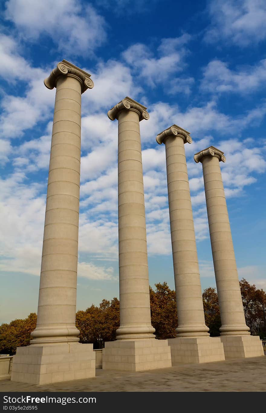 Four massive columns, blue sky