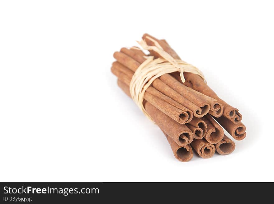 Bunch of cinnamon sticks on white background