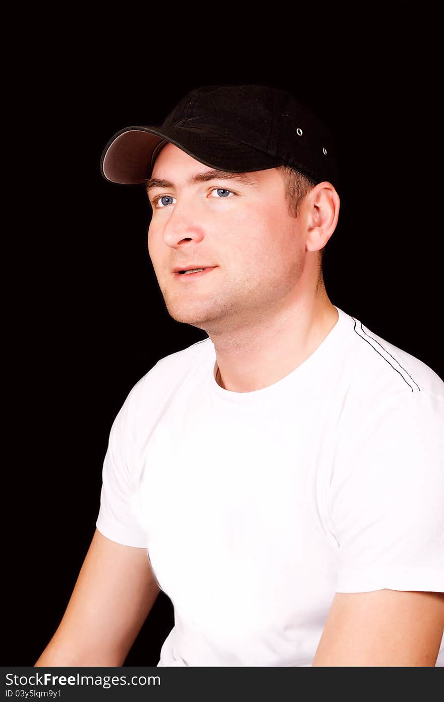 Serious Hispanic man wearing cap