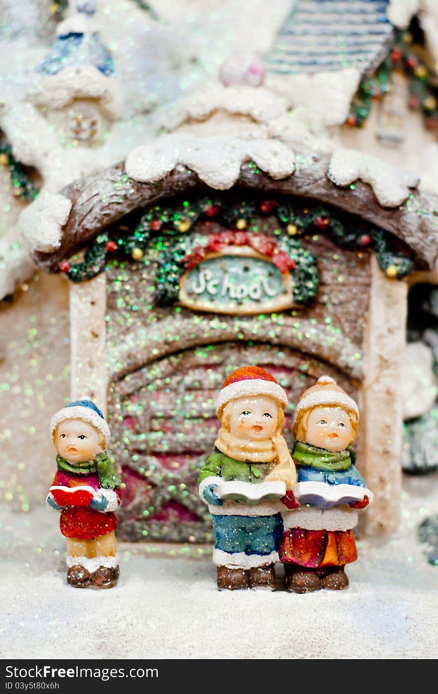 Christmas choir. Group of children singing a song in front of school. Christmas choir. Group of children singing a song in front of school.