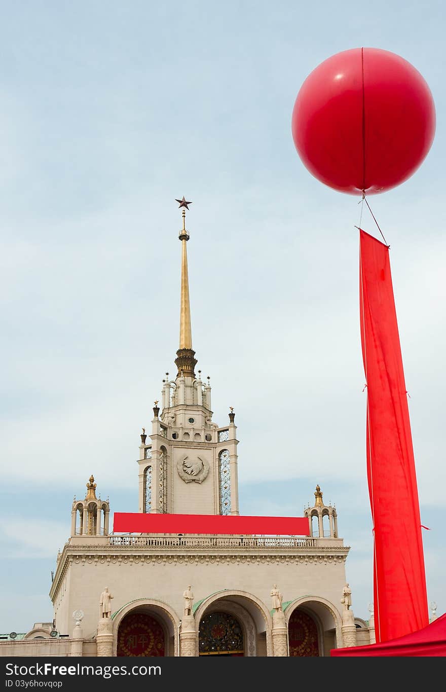 Celebration balloon and red flag flying over the Beijing Exhibition Center, China