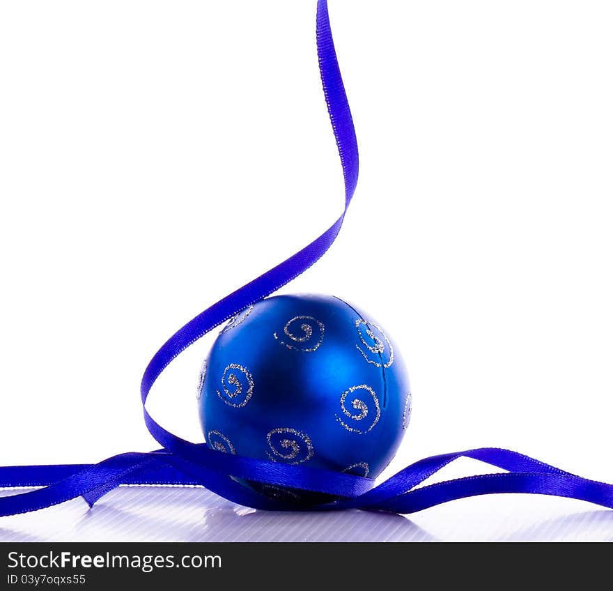 Blue bauble with the blue ribbon on the white background