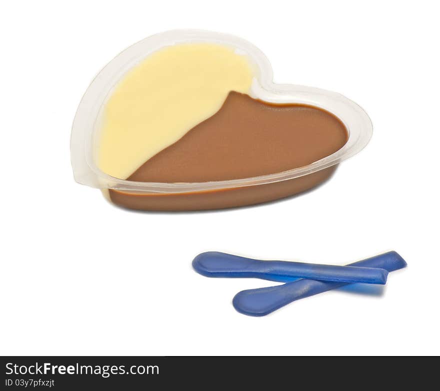 Chocolate and vanilla cream with two blue spoons on white background