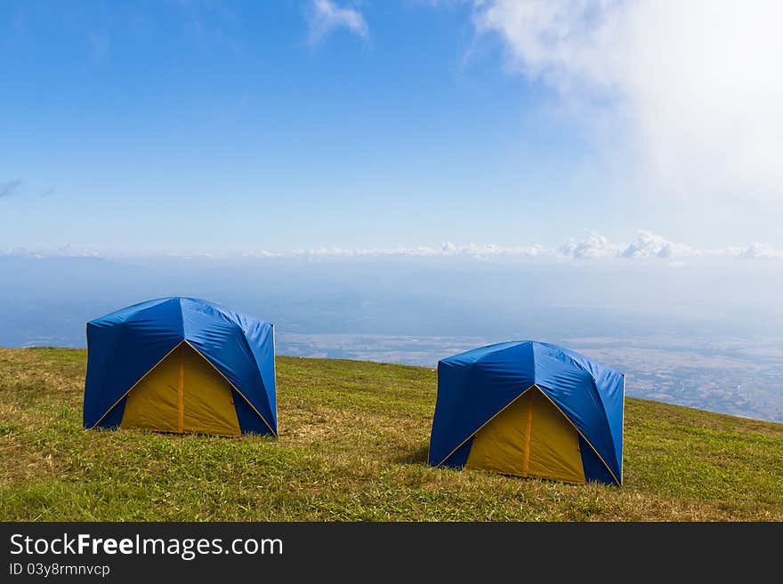 Two Tent on a grass under  blue sky