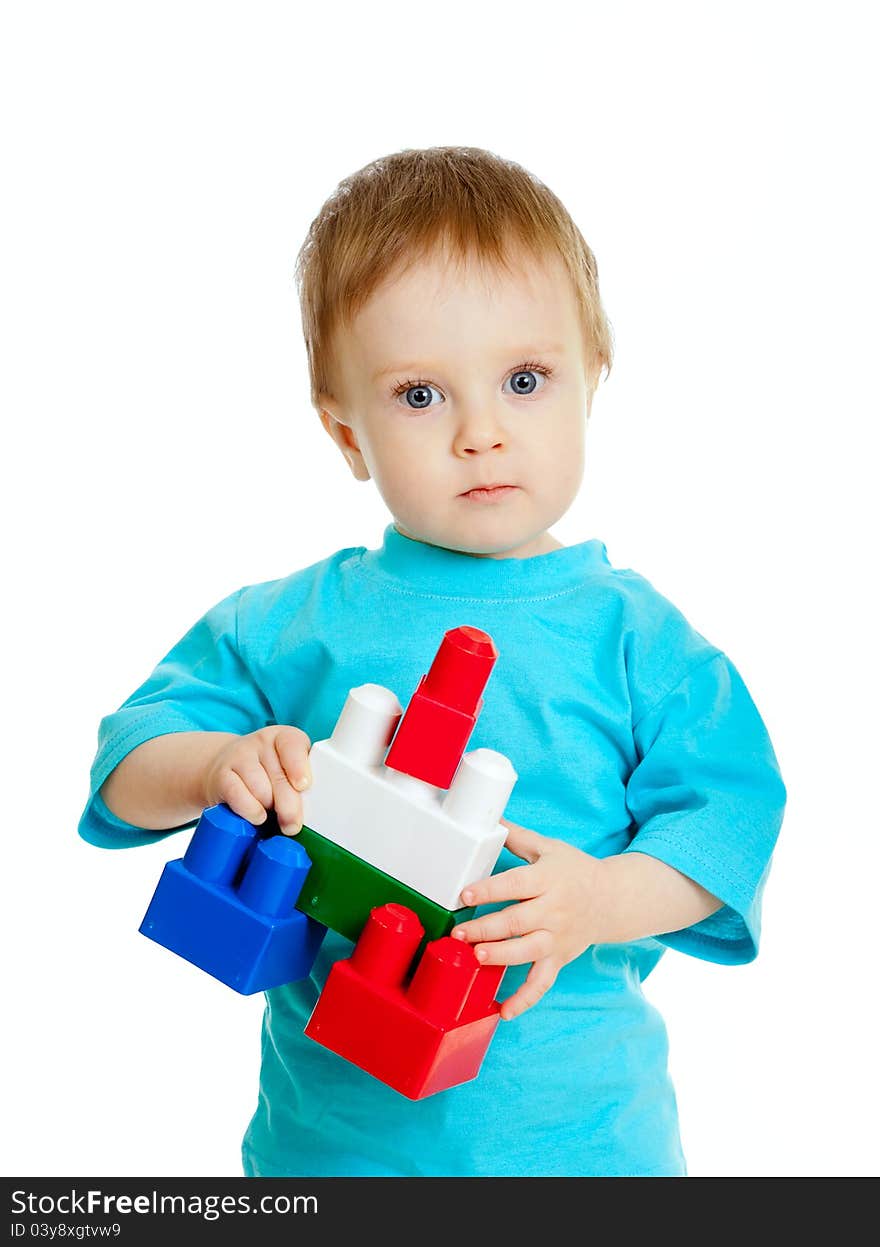 Little child with construction set over white background