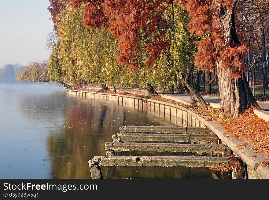 Boat cargo on still river in evening autumn time. Boat cargo on still river in evening autumn time