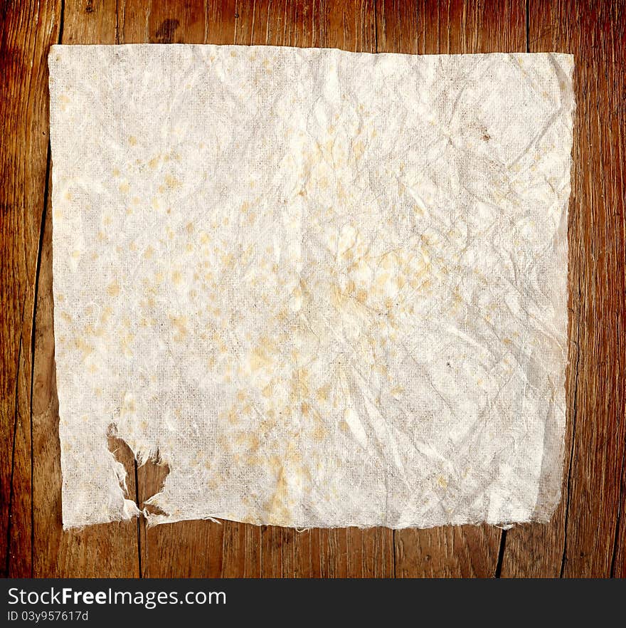 Crumpled Paper On Wooden Background