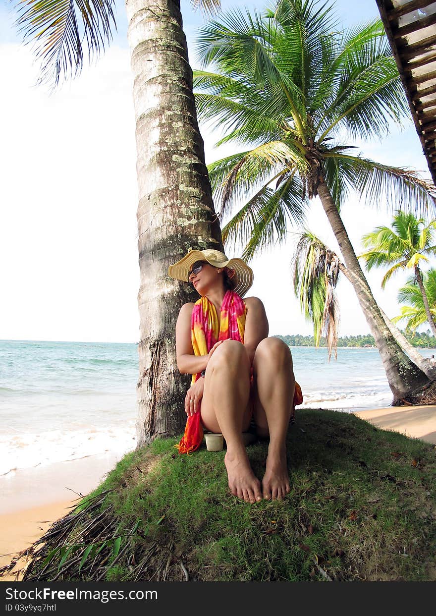 Woman relaxing on beach with coconut palms - Bahia - Brazil. Woman relaxing on beach with coconut palms - Bahia - Brazil