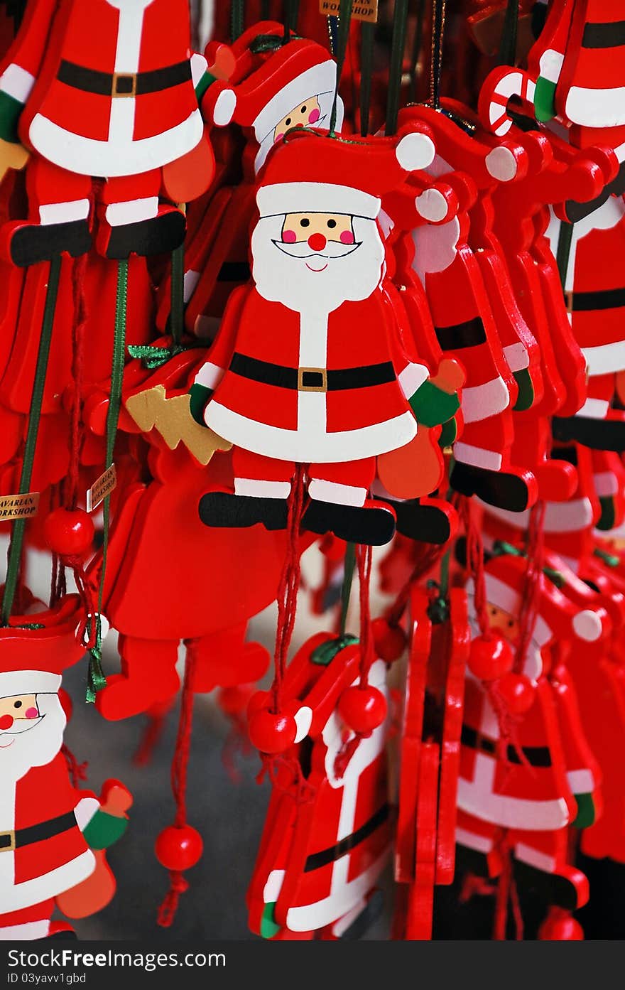 Hanging Santa ornaments on display. Hanging Santa ornaments on display