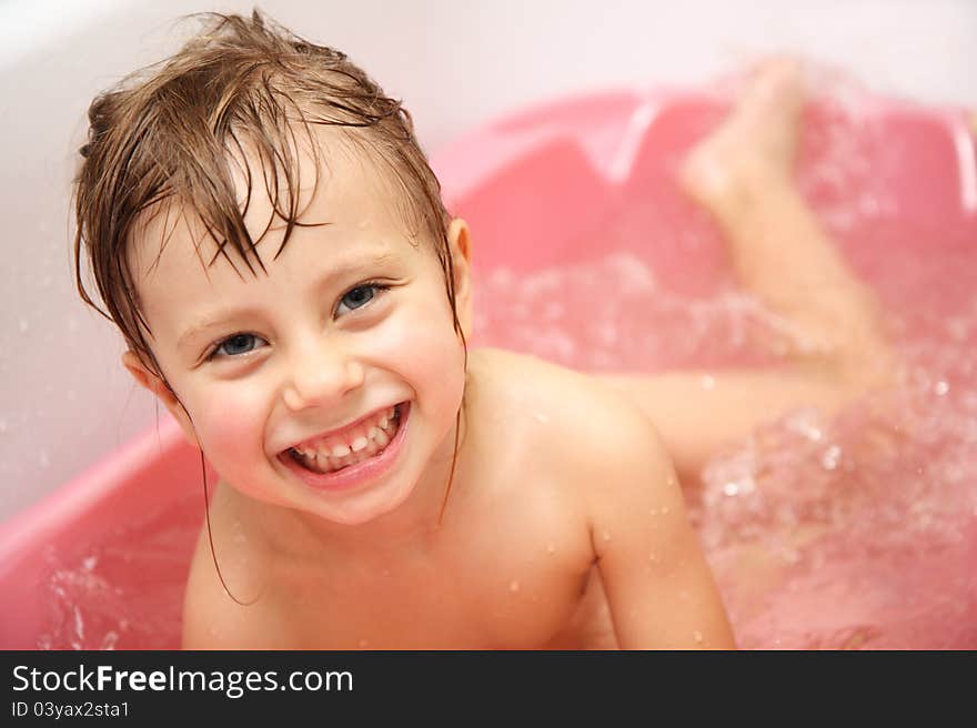 Child Bathes In A Bathroom