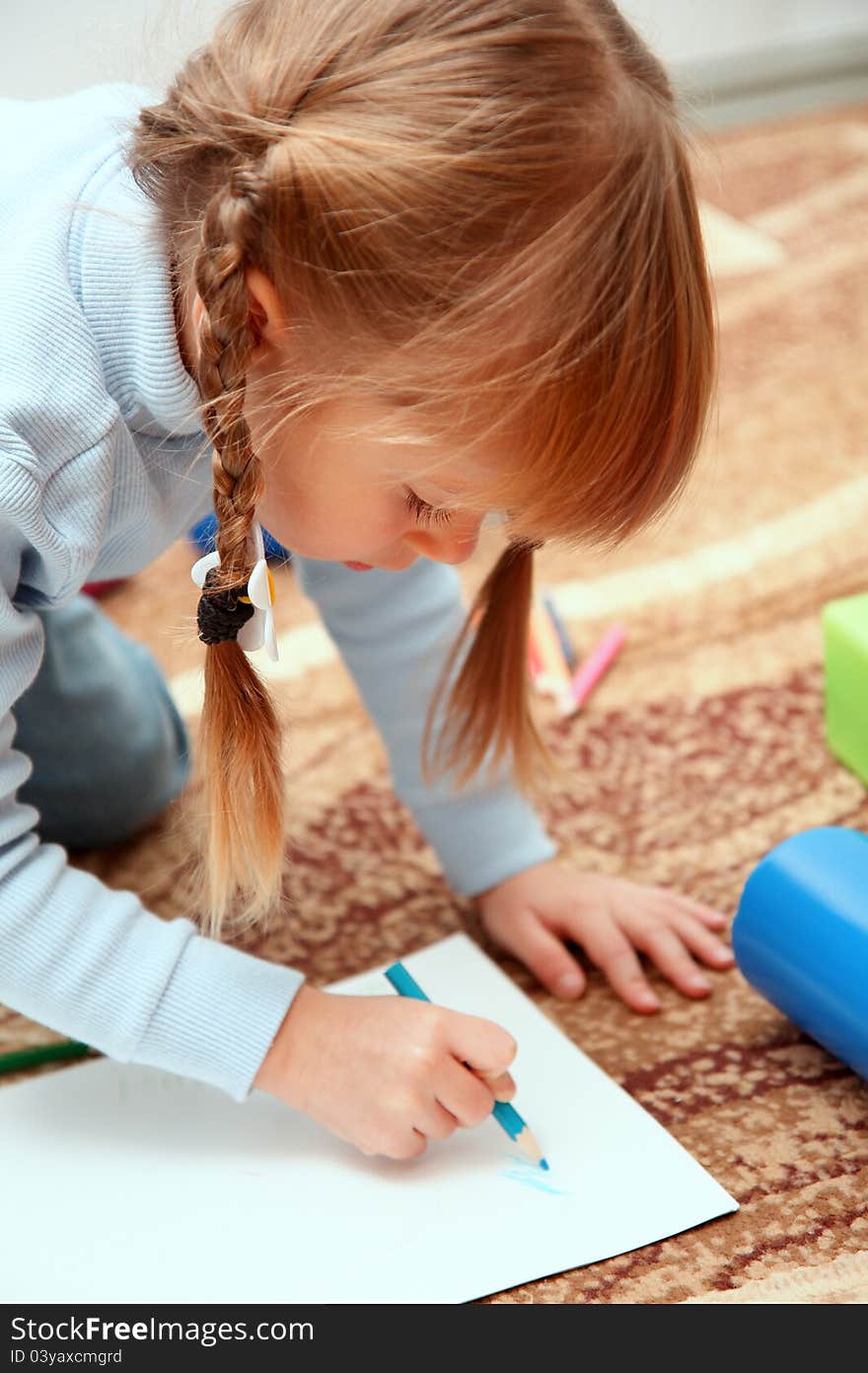 Child draw with colorful crayons